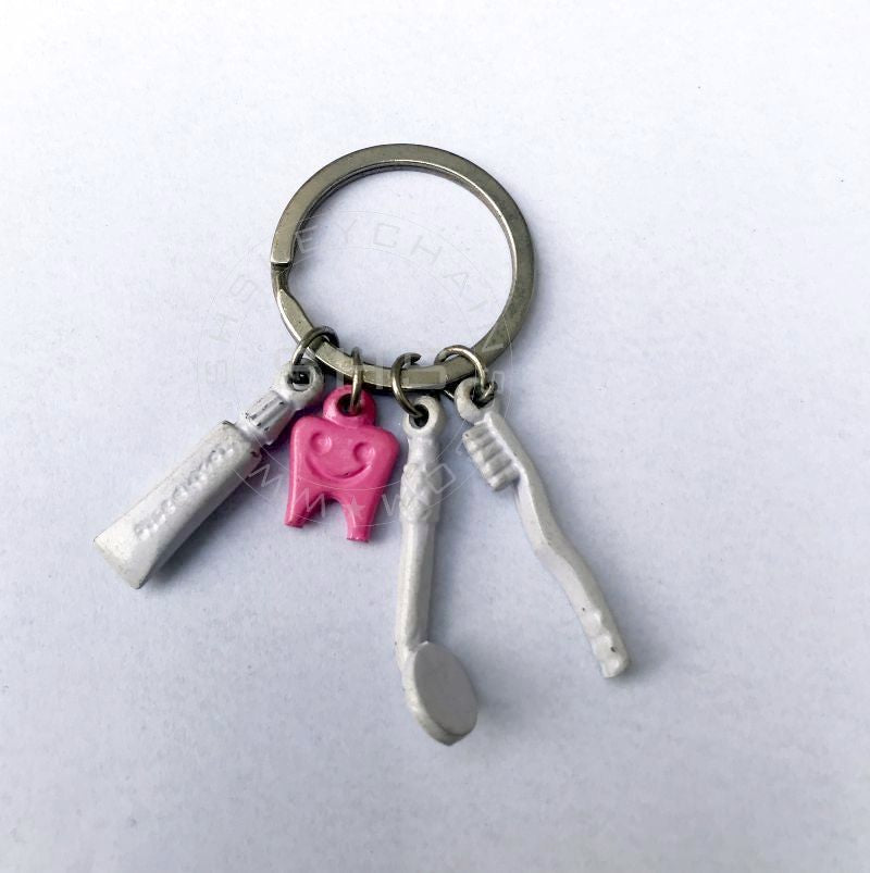 Pink tooth with Brush, Paste and Mirror Charms keychain